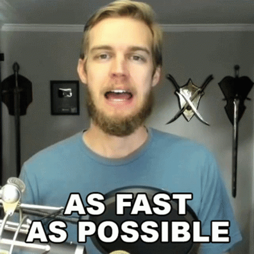 A Man With A Beard Stands In Front Of A Microphone With The Words As Fast As Possible Written On It GIF