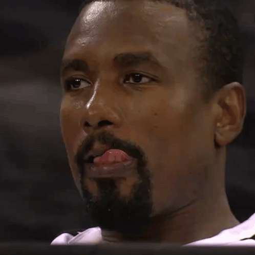 A Man With A Beard Sticks His Tongue Out GIF
