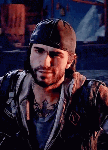 A Man With A Beard Wearing A Baseball Cap And A Leather Jacket Is Looking At The Camera . GIF