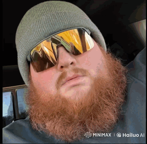 A Man With A Beard Wearing A Beanie And Sunglasses Has A Watermark That Says Hailuo Ai GIF