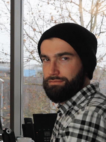 A Man With A Beard Wearing A Black Beanie GIF