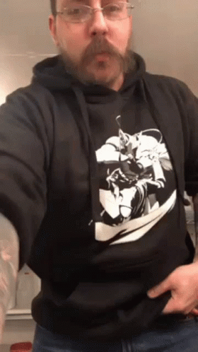 A Man With A Beard Wearing A Black Hoodie GIF