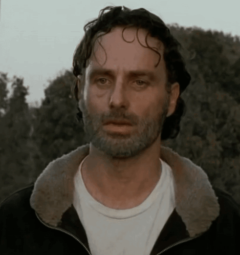 A Man With A Beard Wearing A Black Jacket And A White Shirt GIF