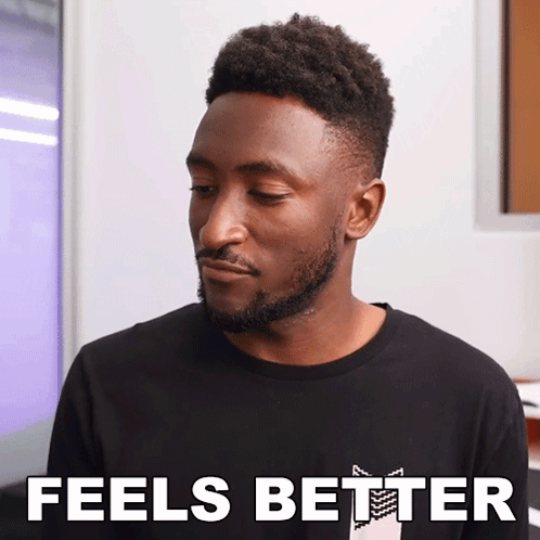 A Man With A Beard Wearing A Black Shirt That Says " Feels Better " GIF