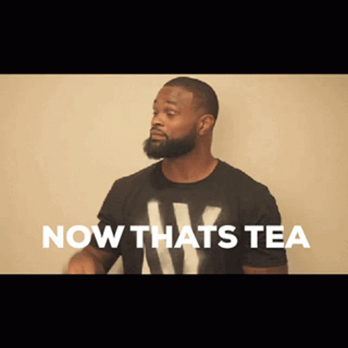 A Man With A Beard Wearing A Black Shirt That Says Now Thats Tea GIF