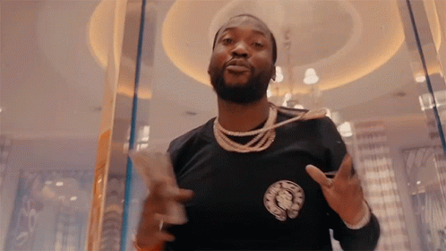 A Man With A Beard Wearing A Black Shirt With The Word Chrome Hearts On The Front GIF