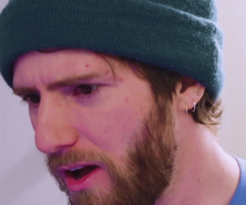 A Man With A Beard Wearing A Blue Beanie GIF