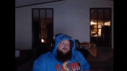 A Man With A Beard Wearing A Blue Casson Hoodie GIF