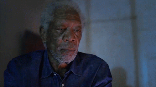 A Man With A Beard Wearing A Blue Shirt GIF