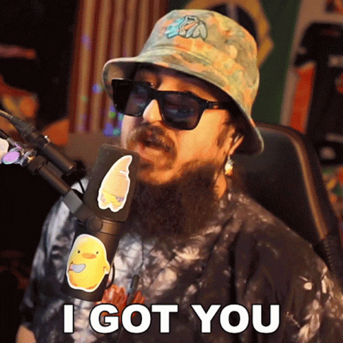 A Man With A Beard Wearing A Bucket Hat And Sunglasses Says I Got You GIF