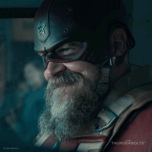 A Man With A Beard Wearing A Captain America Helmet With A Star On It GIF