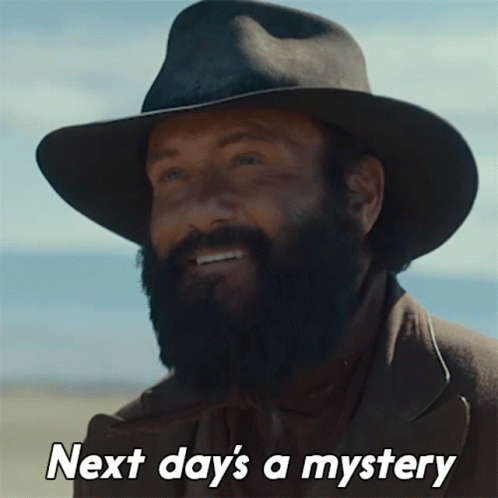 A Man With A Beard Wearing A Cowboy Hat With The Words Next Day 'S A Mystery GIF