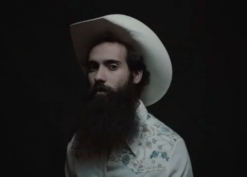A Man With A Beard Wearing A Cowboy Hat GIF