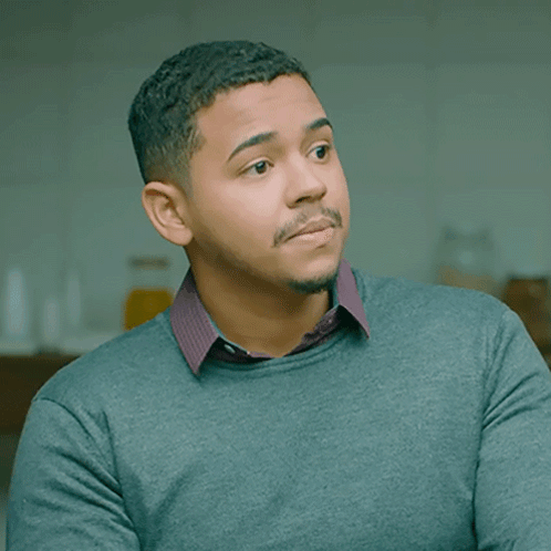 A Man With A Beard Wearing A Grey Sweater GIF