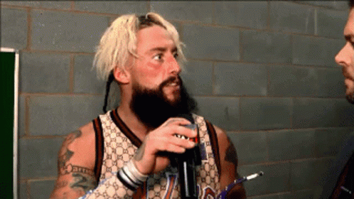 a man with a beard wearing a gucci jersey