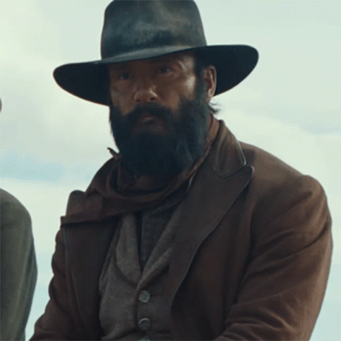 A Man With A Beard Wearing A Hat And Brown Jacket GIF