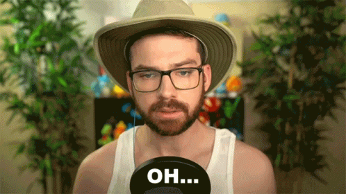 A Man With A Beard Wearing A Hat And Glasses Says " Oh " GIF
