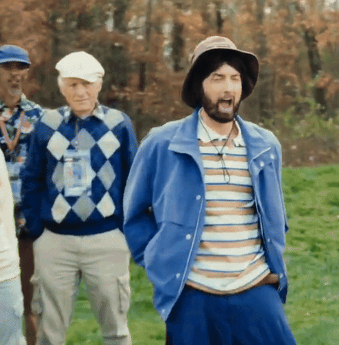 A Man With A Beard Wearing A Hat And Striped Shirt GIF