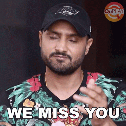 A Man With A Beard Wearing A Hat Says We Miss You GIF