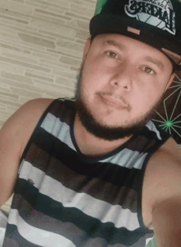 A Man With A Beard Wearing A Hat That Says ' Oakland ' On It GIF