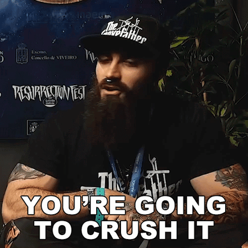 A Man With A Beard Wearing A Hat That Says The Godfather On It GIF