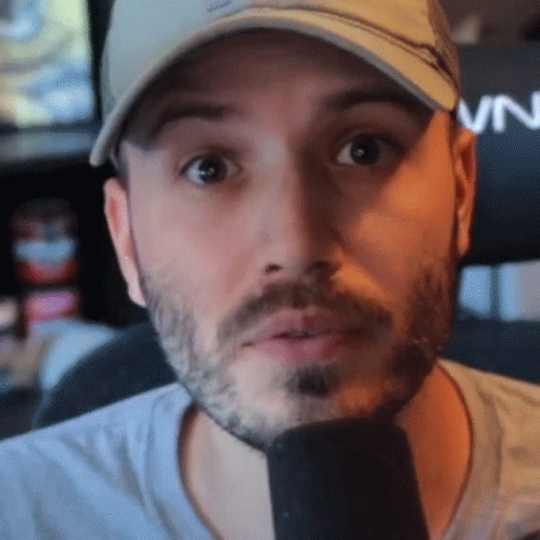 A Man With A Beard Wearing A Hat That Says Vn On It GIF