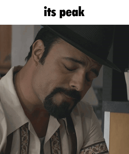 A Man With A Beard Wearing A Hat With The Words " Its Peak " Below Him GIF