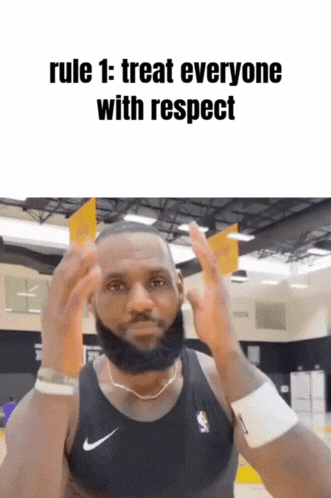 a man with a beard wearing a nike tank top