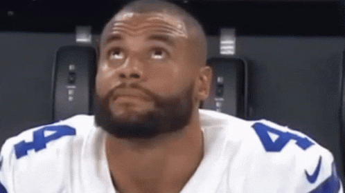A Man With A Beard Wearing A Number 4 Jersey Looks Up GIF