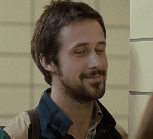 A Man With A Beard Wearing A Plaid Shirt And A Green Jacket GIF