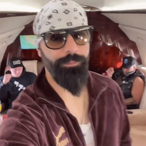 A Man With A Beard Wearing A Puma Jacket GIF