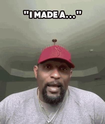 A Man With A Beard Wearing A Red Hat And A Necklace Says " I Made A ... " GIF