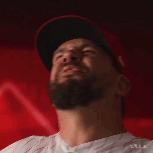 A Man With A Beard Wearing A Red Hat GIF
