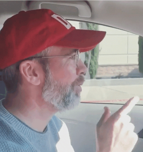 A Man With A Beard Wearing A Red Hat With A Letter D On It GIF