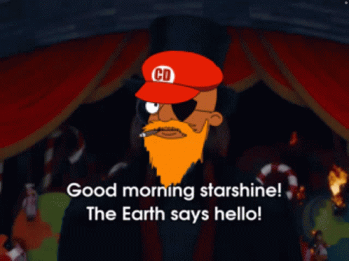 A Man With A Beard Wearing A Red Hat With The Letter Cd On It GIF