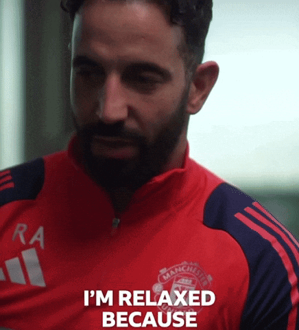 A Man With A Beard Wearing A Red Manchester United Shirt GIF