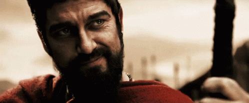 A Man With A Beard Wearing A Red Shirt GIF