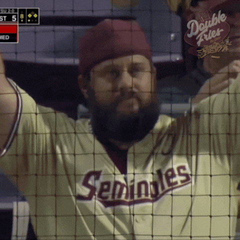 a man with a beard wearing a seminoles jersey