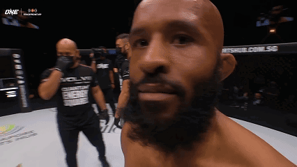 A Man With A Beard Wearing A Shirt That Says Evolve GIF