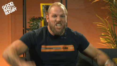 A Man With A Beard Wearing A Shirt That Says Gbr GIF