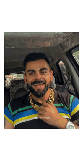 A Man With A Beard Wearing A Striped Shirt And A Gold Chain Around His Neck GIF