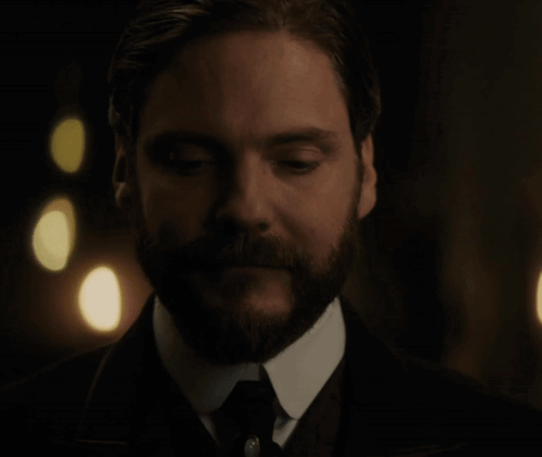 Bearded Man In Suit Looking Down GIF