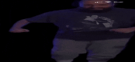 A Man With A Beard Wearing A T-Shirt With A Picture Of A Man On It GIF