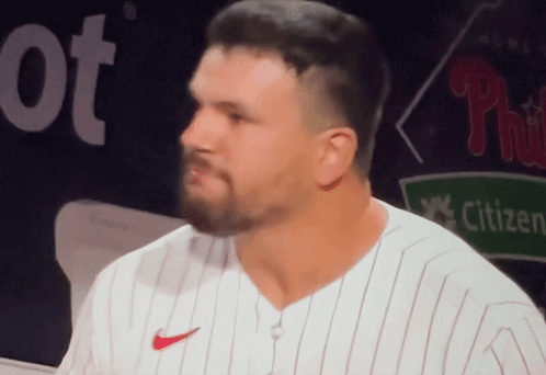 A Man With A Beard Wearing A White Nike Jersey GIF