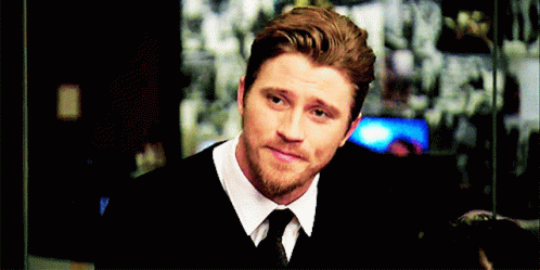 A Man With A Beard Wearing A White Shirt And Tie GIF