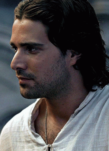 A Man With A Beard Wearing A White Shirt GIF