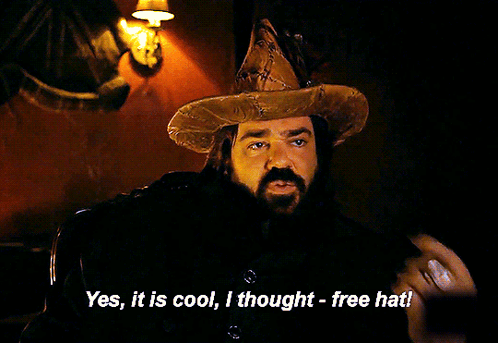 A Man With A Beard Wearing A Wizard Hat Says " Yes It Is Cool I Thought Free Hat " GIF