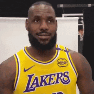A Man With A Beard Wearing A Yellow Lakers Jersey . GIF
