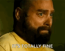 A Man With A Beard Wearing A Yellow Shirt Says It 'S Totally Fine . GIF