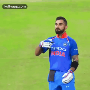 A Man With A Beard Wearing An Oppo India Shirt GIF